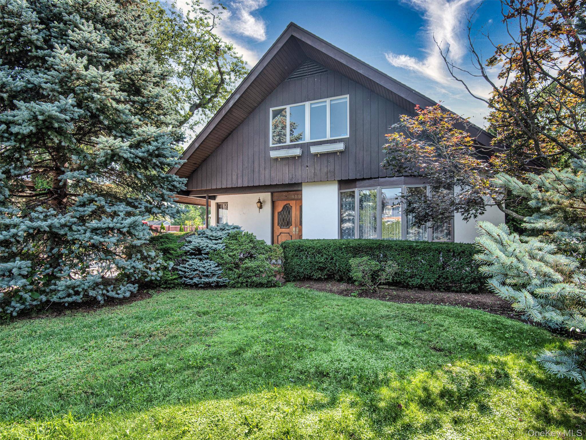 Welcome to this lovely 2, 400 square foot home nestled in The Village of Farmingdale !