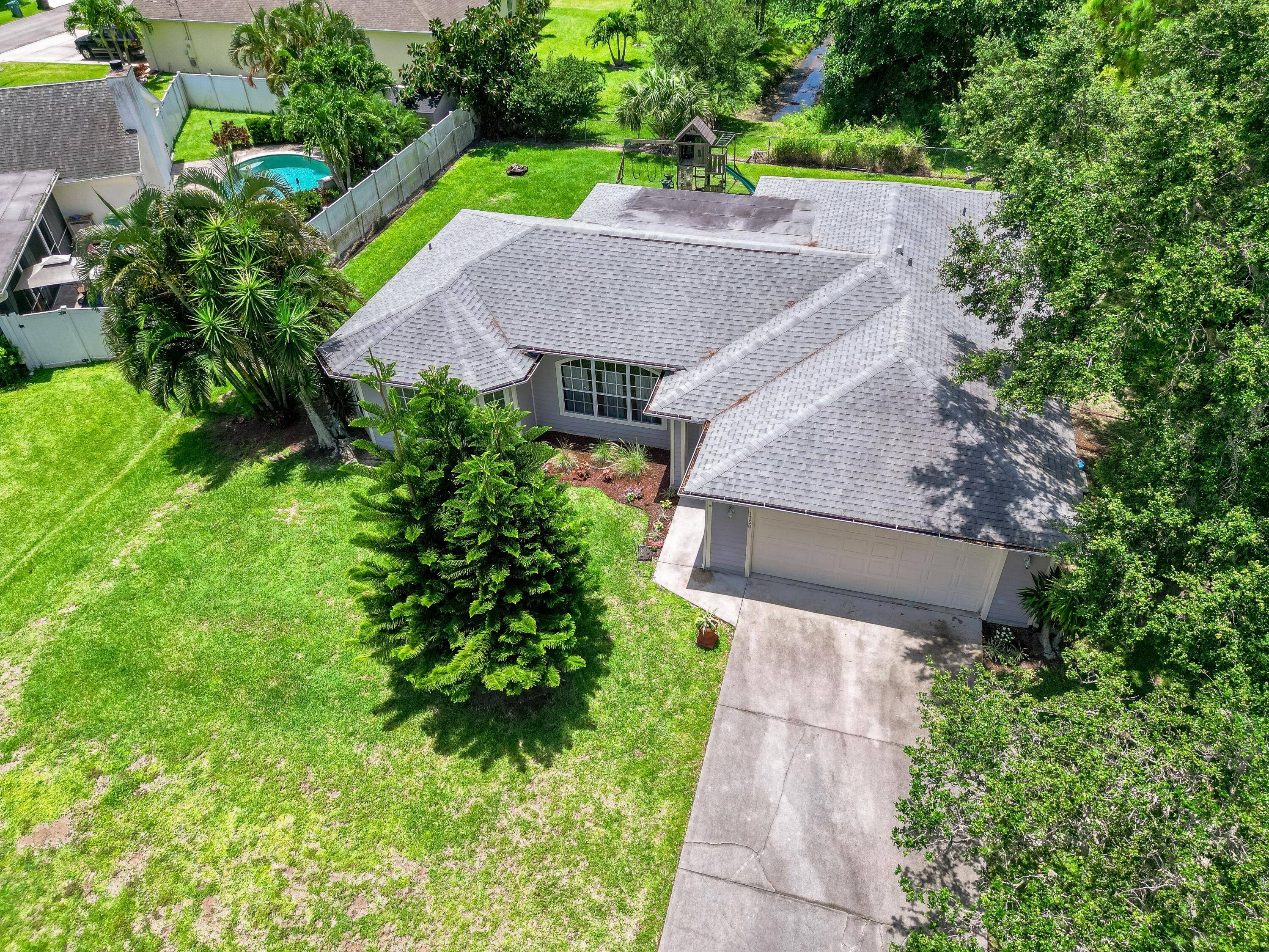 Let's Make a Deal. Nestled In a Tranquil Neighborhood, this 3 2 2 Gem with Large, Covered Patio Won't Long on This Over Sized Lot !