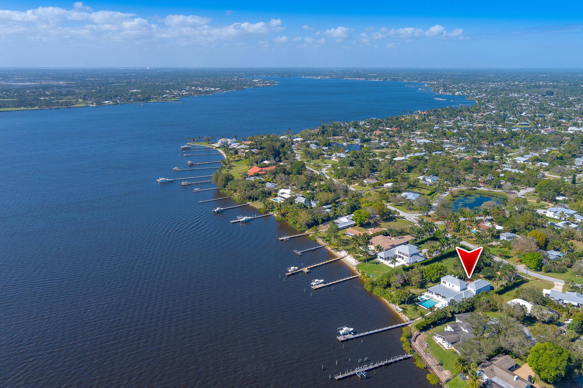 Discover unparalleled luxury in this waterfront oasis, a prestigious estate nestled on almost 1 acre with awe inspiring views of the St Lucie River.