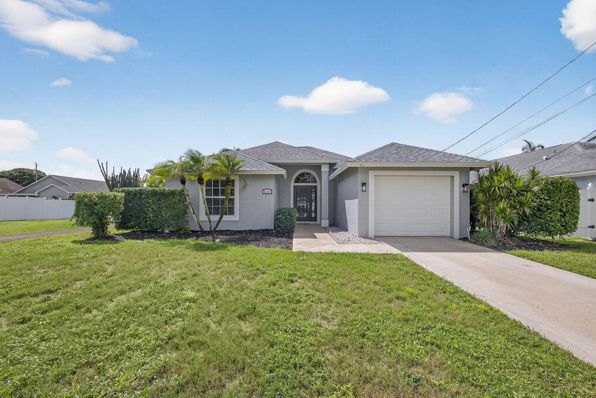 Welcome to this beautifully maintained pool home in the heart of Jupiter's sought after North Palm Beach Heights !