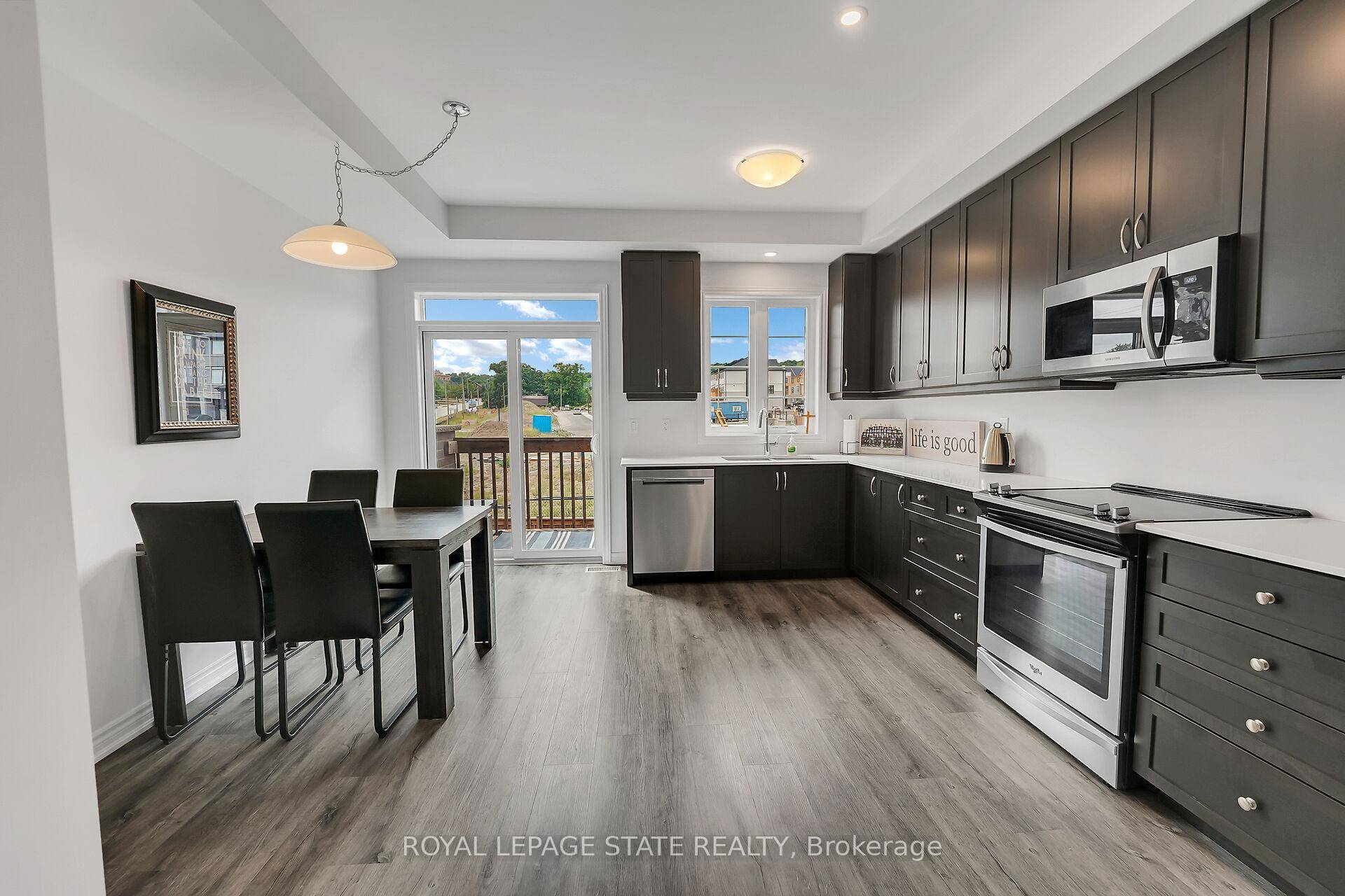 PRIVATE BACKYARD AND NO CONDO FEES Welcome to this beautifully updated 3 bedroom, three storey freehold townhome, ideally situated in a quiet, family friendly neighbourhood in Beamsville.