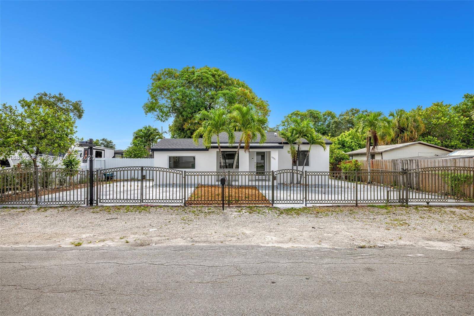Fully renovated single family home with new impact windows, roof, pluming, and electrical.