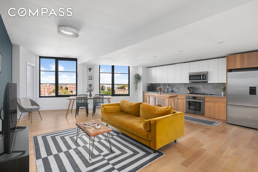 This stunning Penthouse, 811 at 264 Webster Avenue, offers seamless living with the added benefit of low monthly costs, thanks to a tax abatement in place until 2034.