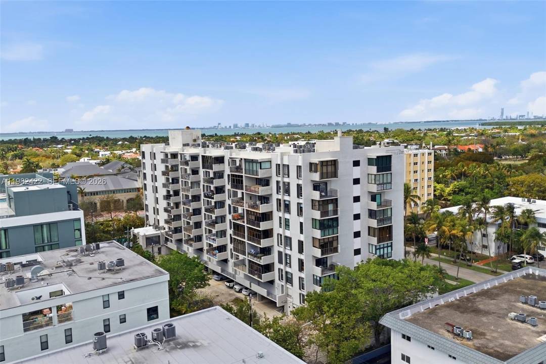 Bright and spacious 2BR 2BA residence in Key Biscayne featuring an open concept living and dining area with wide plank wood floors and abundant natural light.