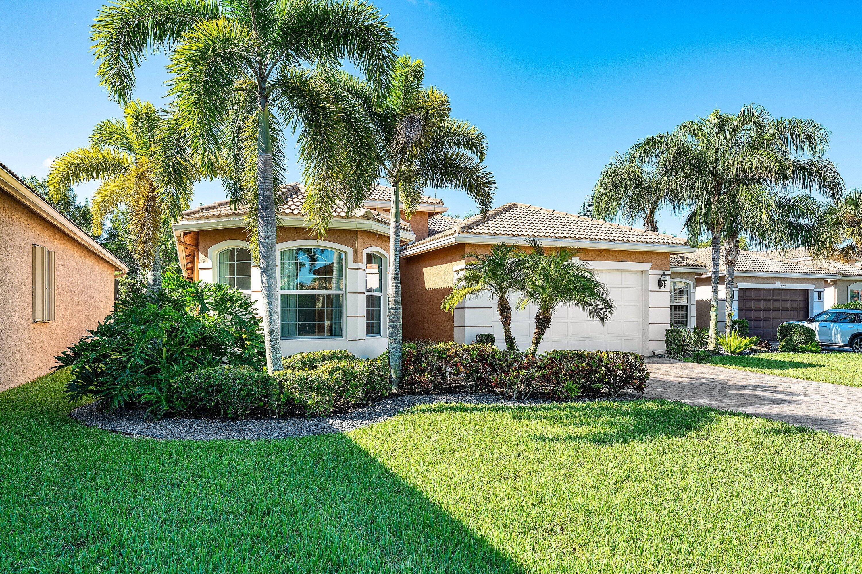 This lushly landscaped 3 bedroom den Gibralter model sits on an oversized private lot backing south.