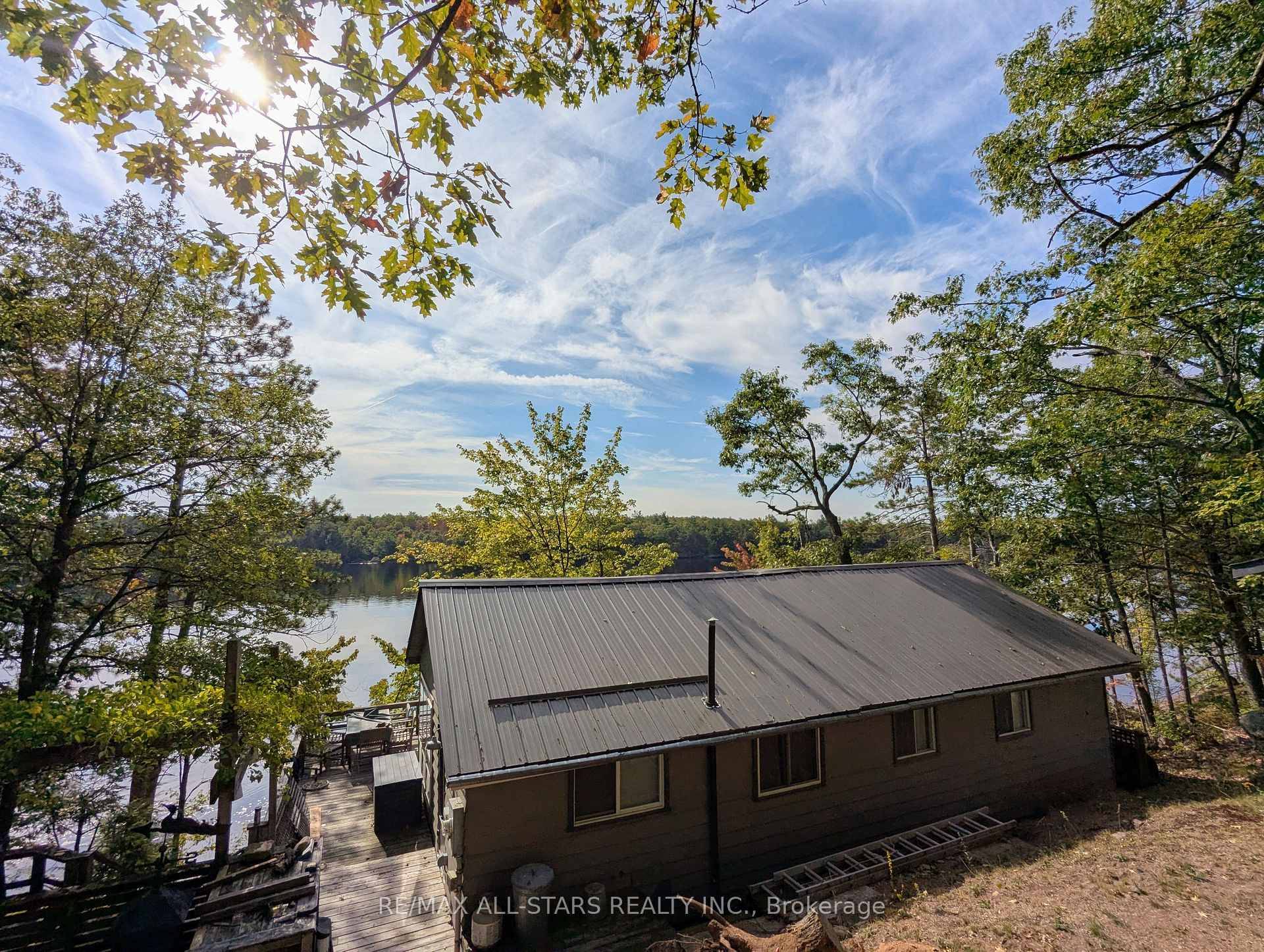 First time available in 40 years, quintessential cottage with 123 feet of prime waterfront on Loucks Lake !