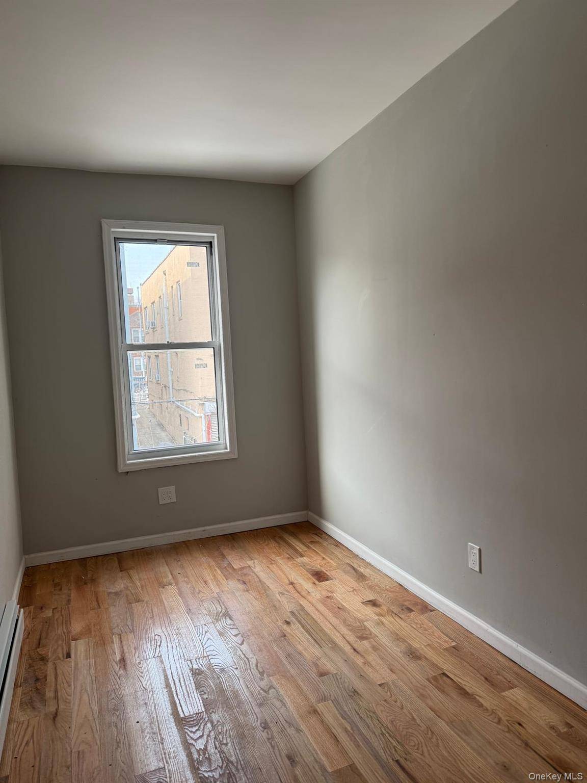 Bright and sunny fully renovated first floor apartment with hardwood floors throughout.