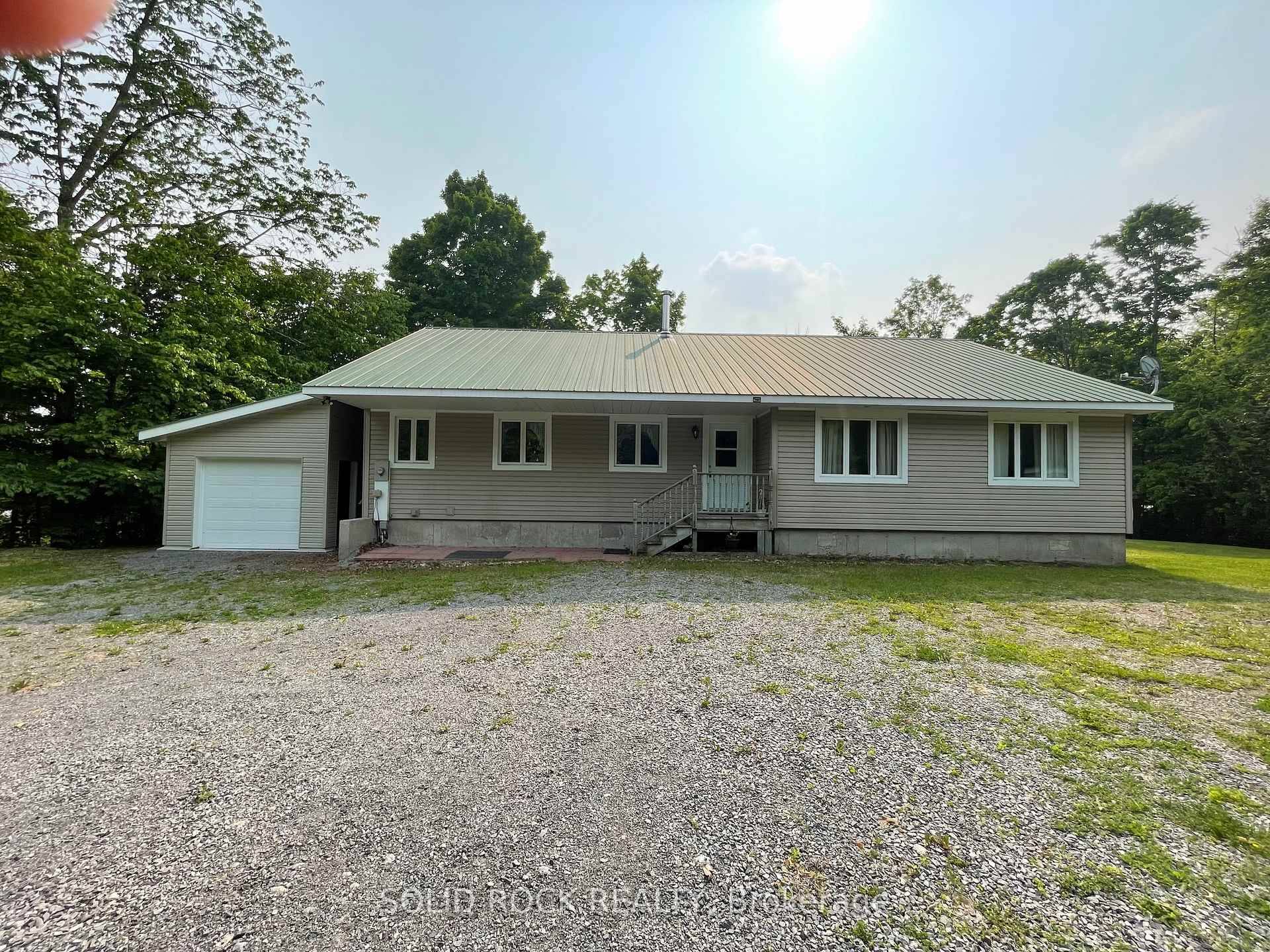 Spacious 4 bedroom, 2 bath bungalow set on over 11 acres in the quiet village of Vernon with potential to develop the land into a small subdivision.