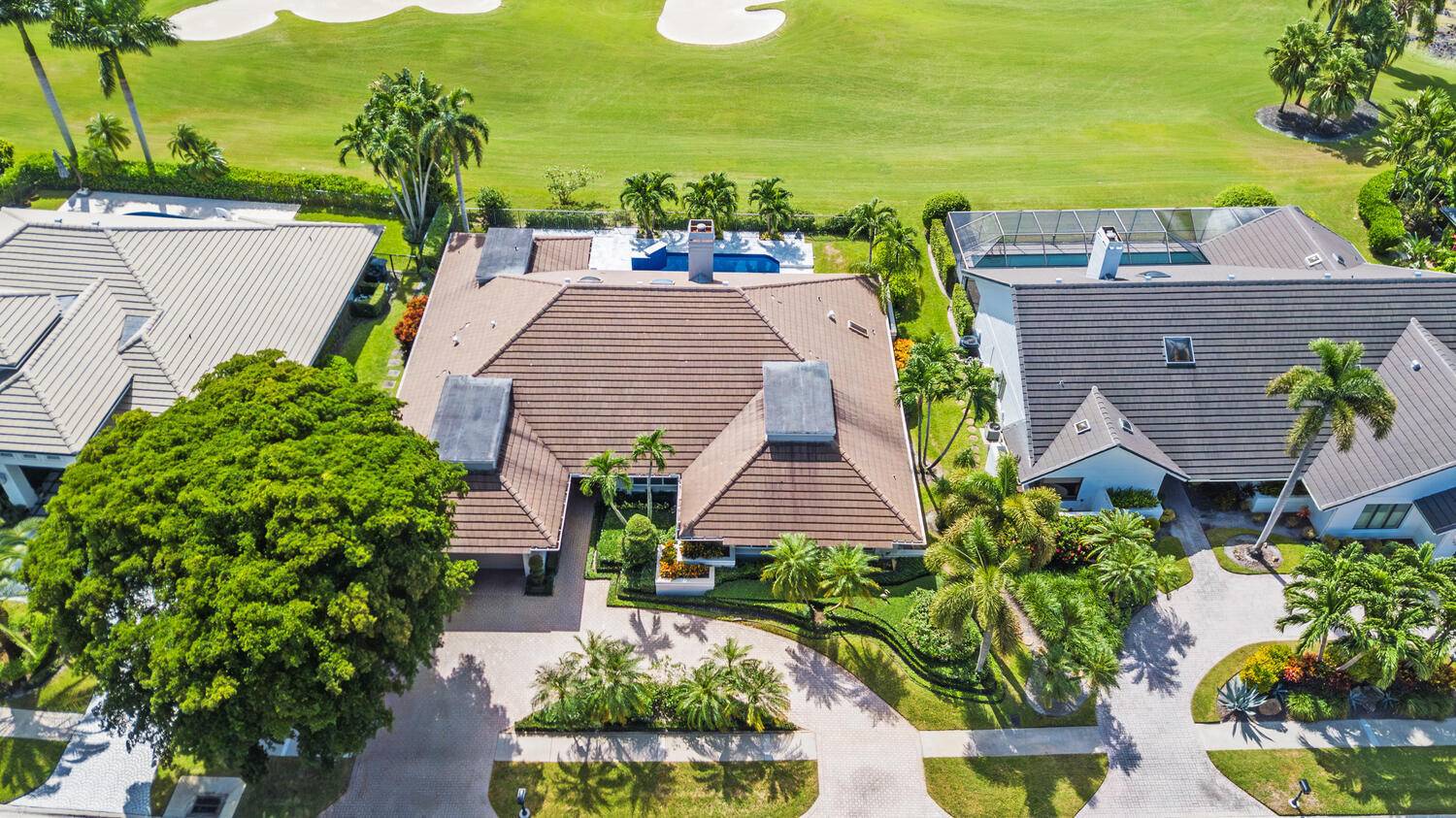This elegantly remodeled contemporary pool home is located in the highly esteemed, private equity membership country club of Boca Grove.