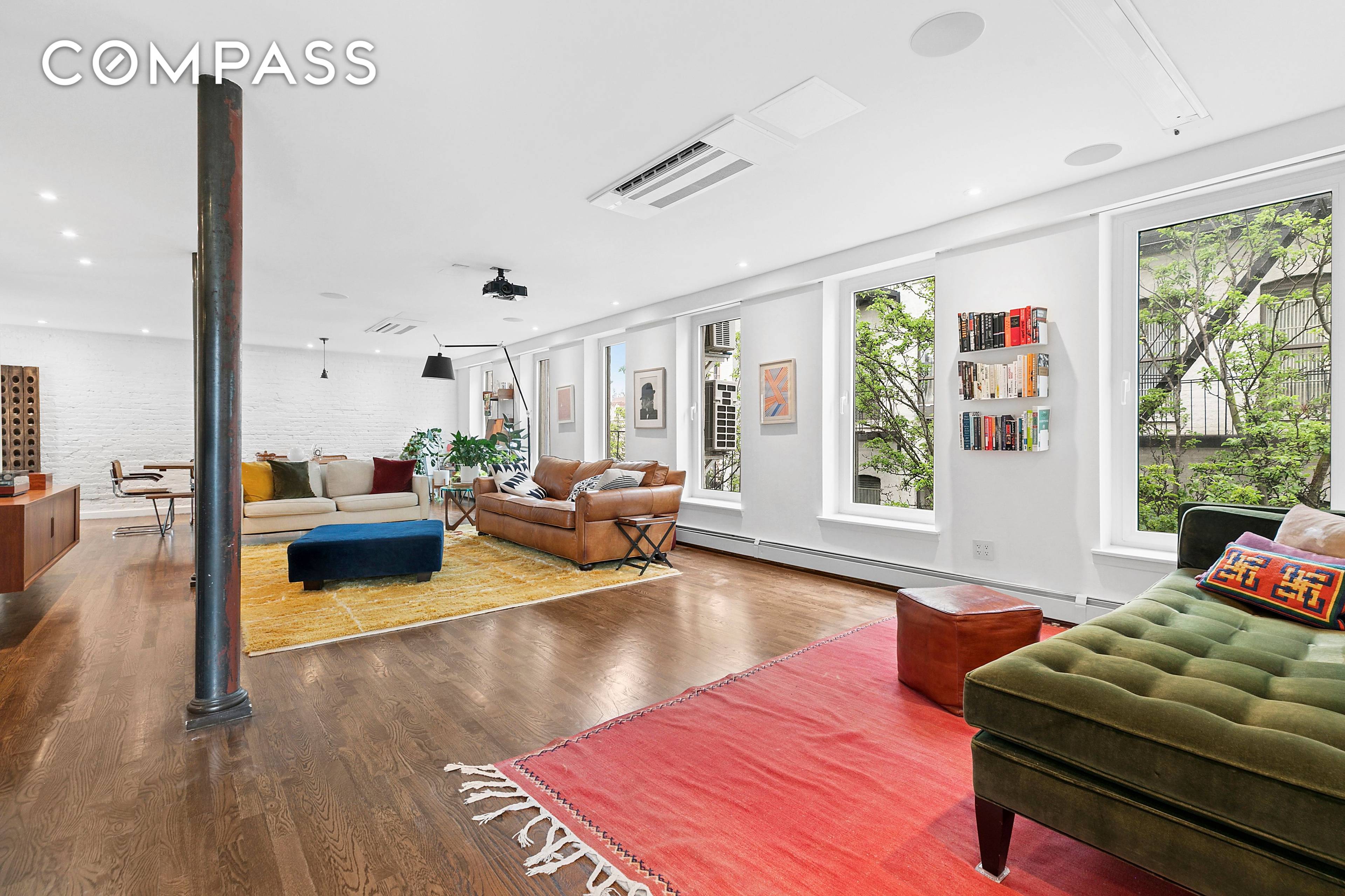 Welcome to 211 East 3rd Street, Apartment 5R a sun drenched and thoughtfully renovated two bedroom, two bathroom home with exceptionally low monthly carrying costs, in the heart of the ...
