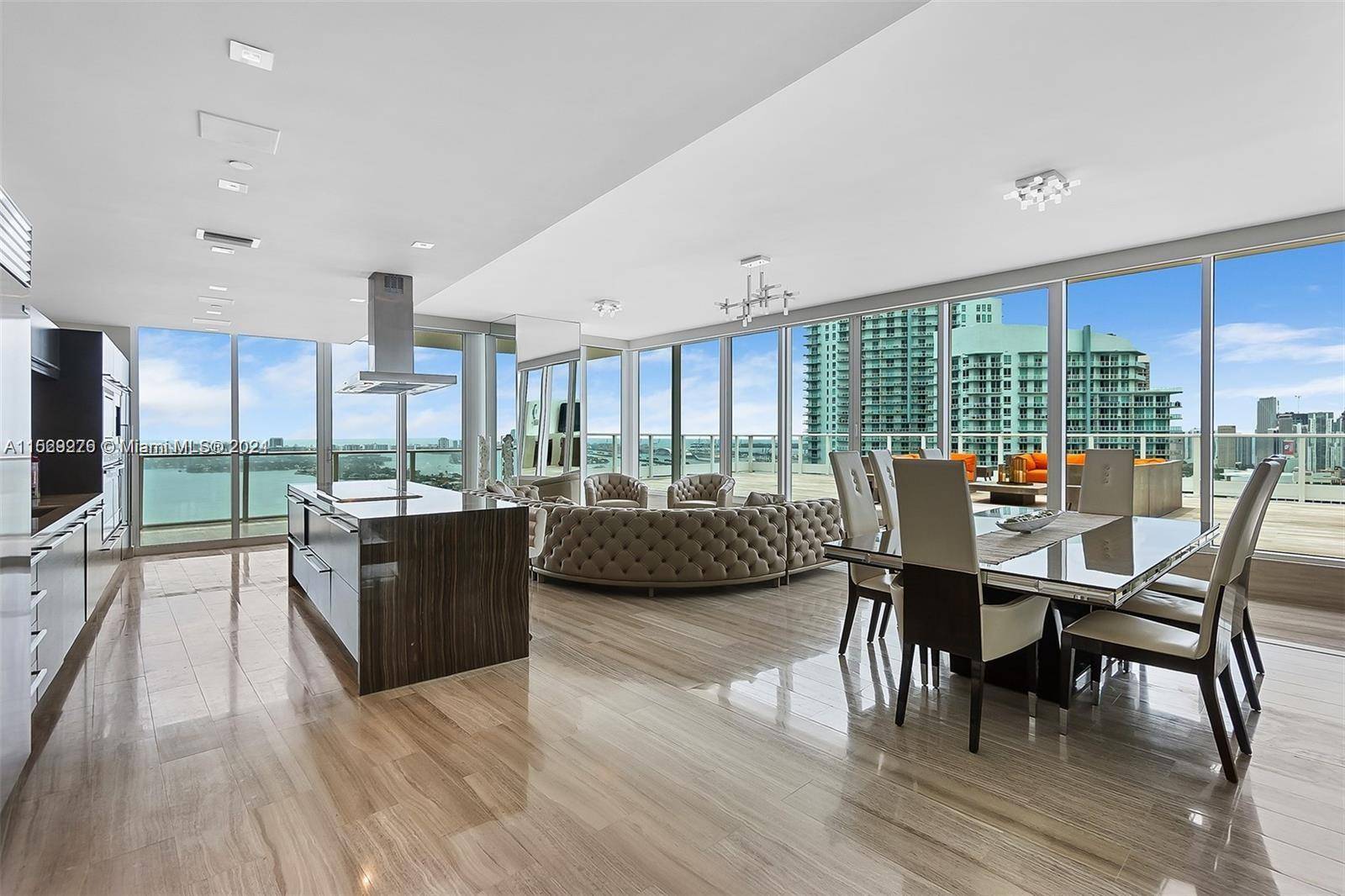 An absolute one of a kind designer Penthouse perched over Biscayne bay with sweeping 270 degree views from the Miami Beach shoreline to the downtown skyline ; from Coconut Grove ...