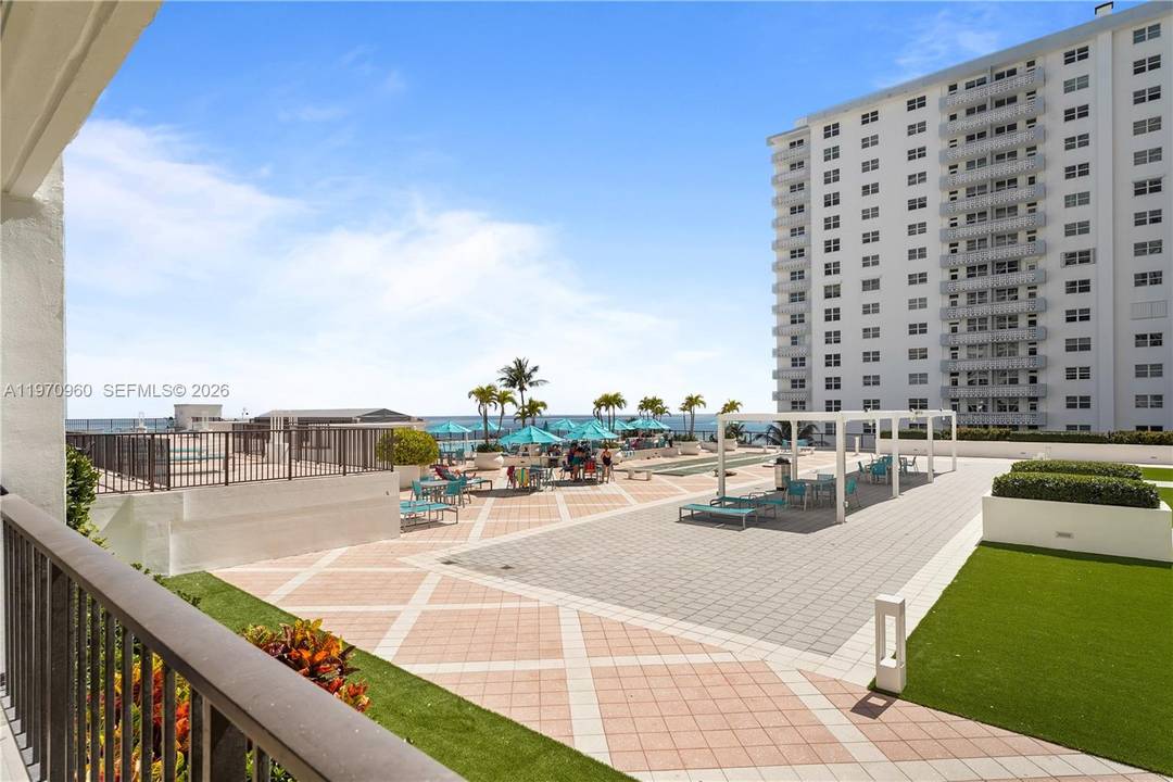 Beautiful ocean and pool deck views from the floor to ceiling windows and large balcony.