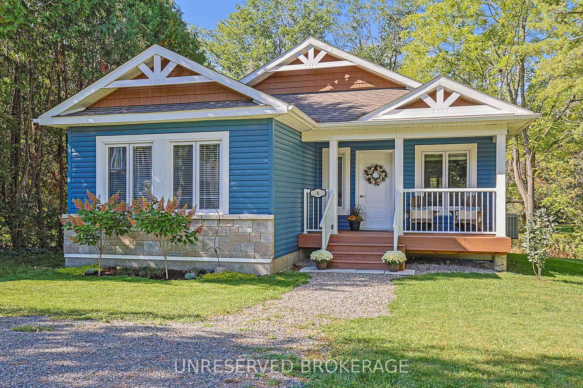 Welcome to 6 Whelan St, Westport a beautifully crafted bungalow on a private, tree lined lot with a creek running through it.
