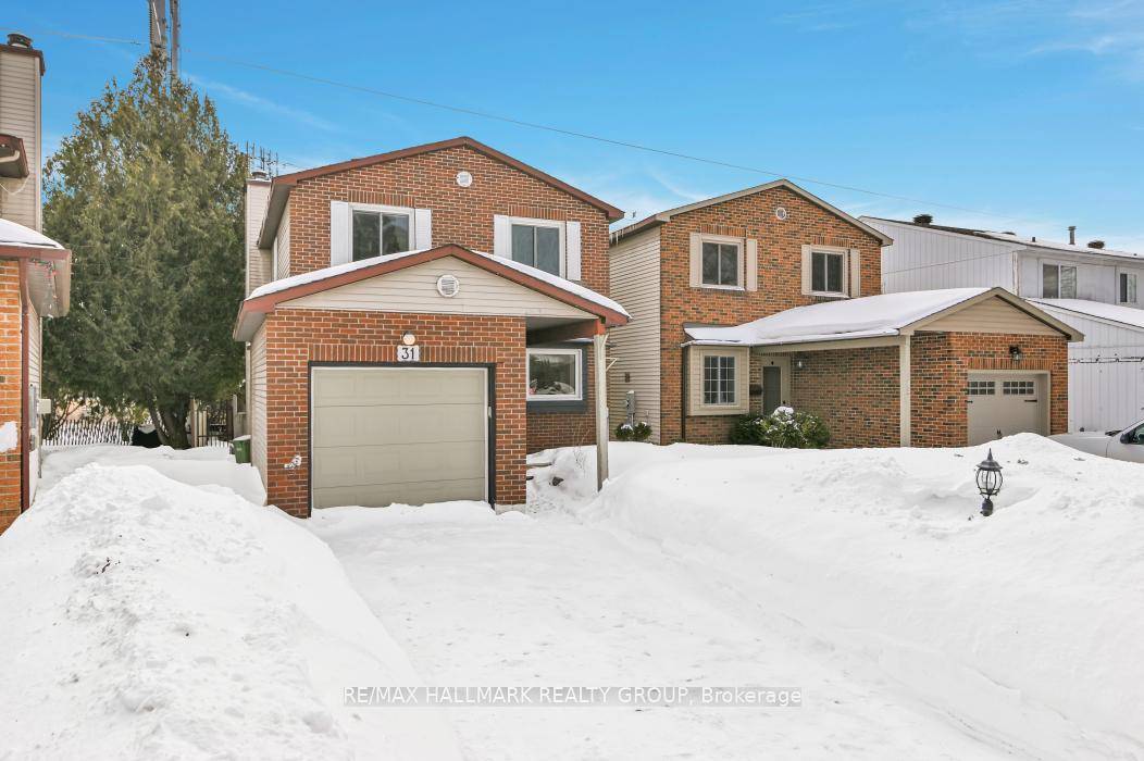 Move in ready, detached home with garage, quiet street, and backing onto walking paths !