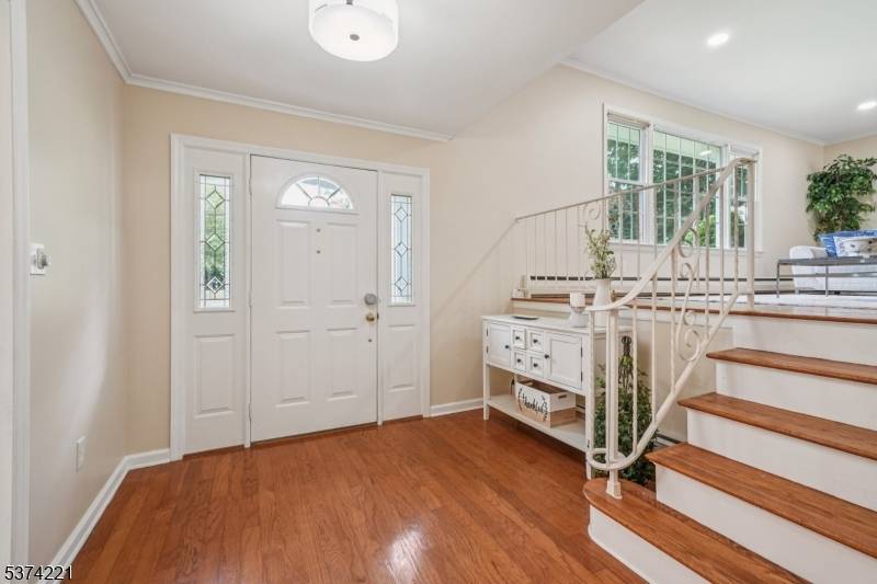 Spacious, sunny and beautifully bright 4 bedroom, 2 1 2 bath Ground Entry Split located in one of the most desirable neighborhoods in New Providence !