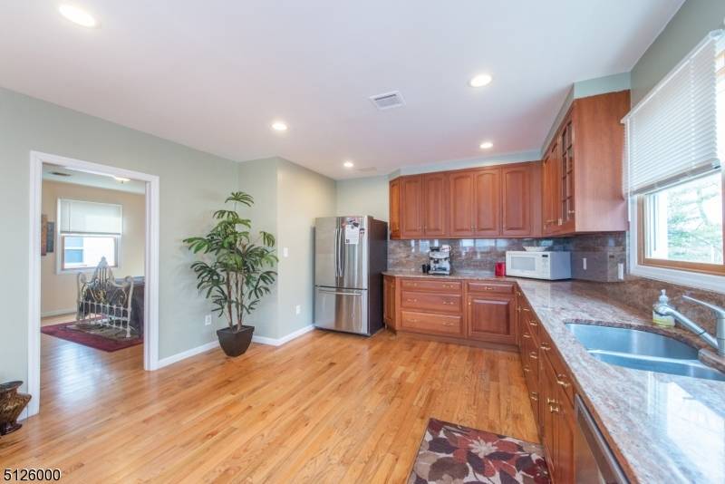 Available now ! Step inside and be greeted by a spacious, modern interior with soaring ceilings, recessed lighting, and an open concept layout bathed in natural light.