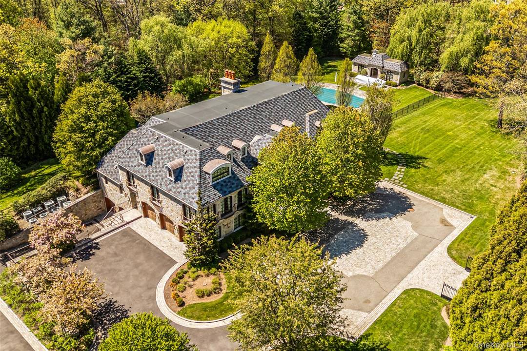 This grand, gated estate blends timeless elegance with modern convenience, showcasing meticulous European craftsmanship throughout.