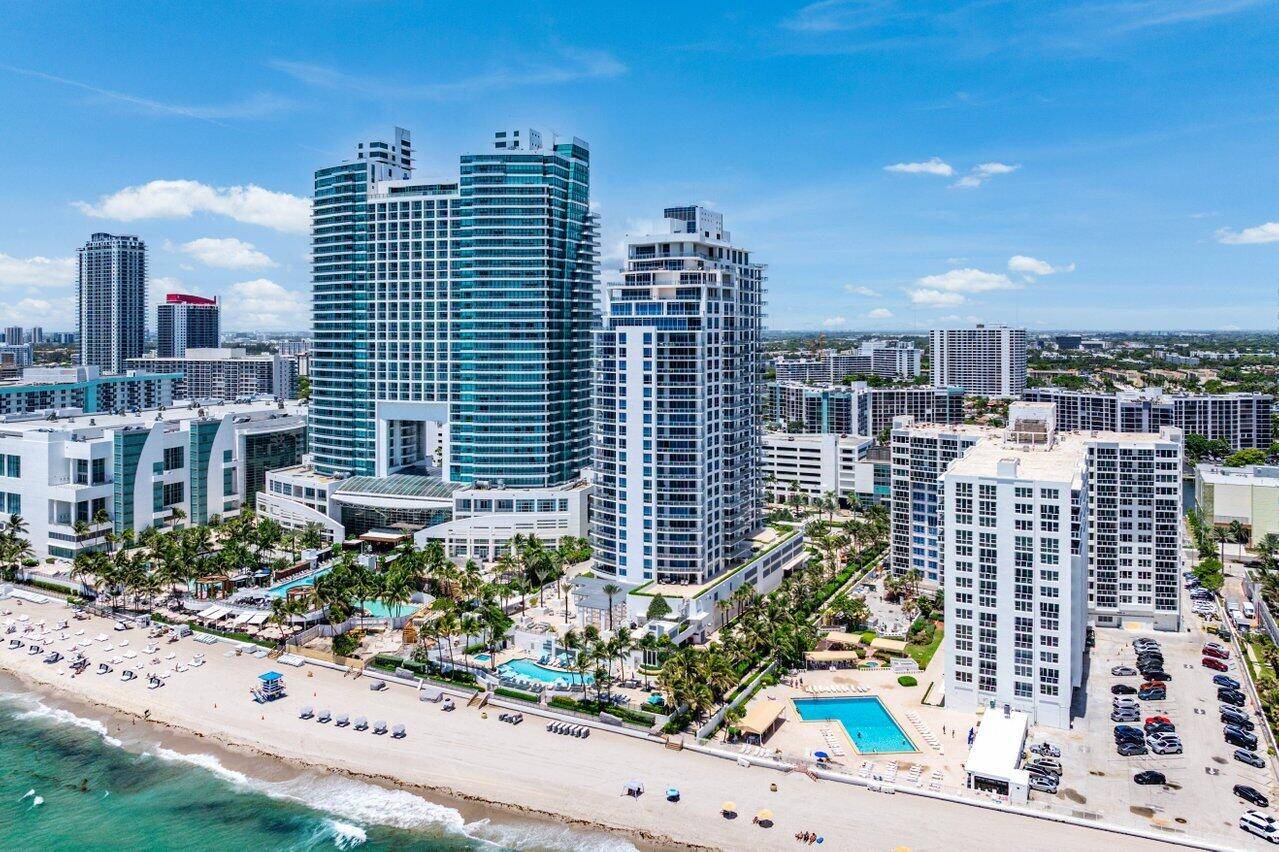 Rare Oceanfront Corner Residence with Direct Beach AccessA true gem at the Diplomat Residences, this exceptional 3 bedroom, 3.