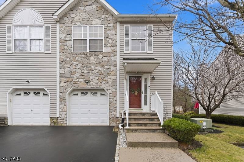 Welcome to this NorthEast facing Colonial style END unit townhome in the desirable Somerset Glen community.