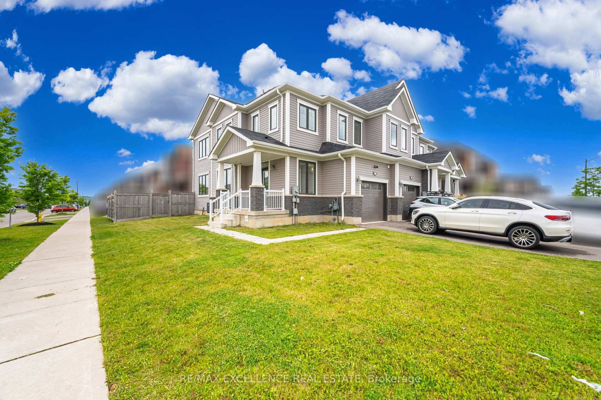 Welcome to 53 Oaktree Drive a stunning, upgraded FREEHOLD END UNIT corner townhome on a premium oversized lot with NO SIDEWALK !
