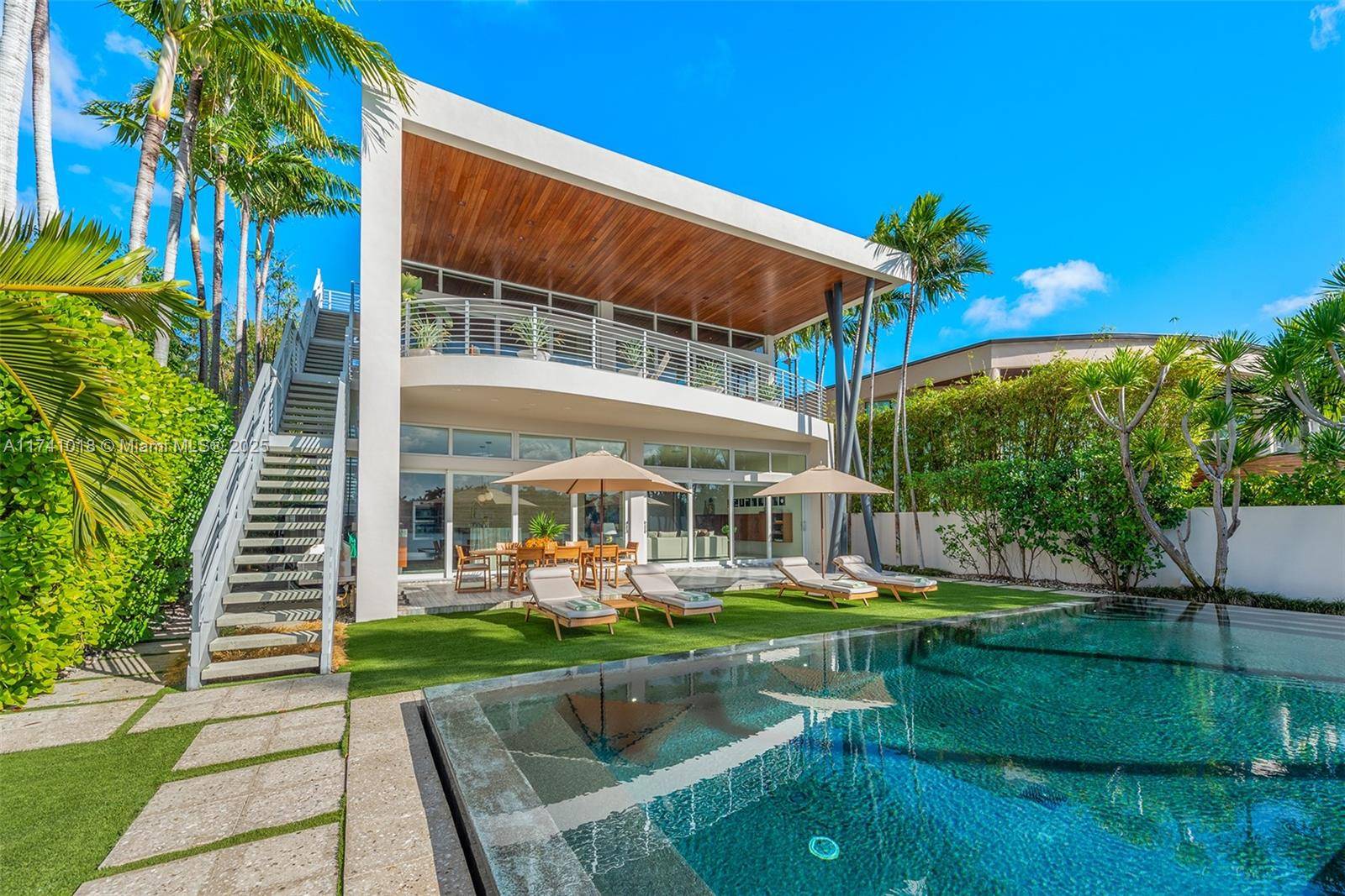 Stunning contemporary home on tropical Venetian Islands with 60 ft waterfrontage and dreamy Miami skyline and sunset views !