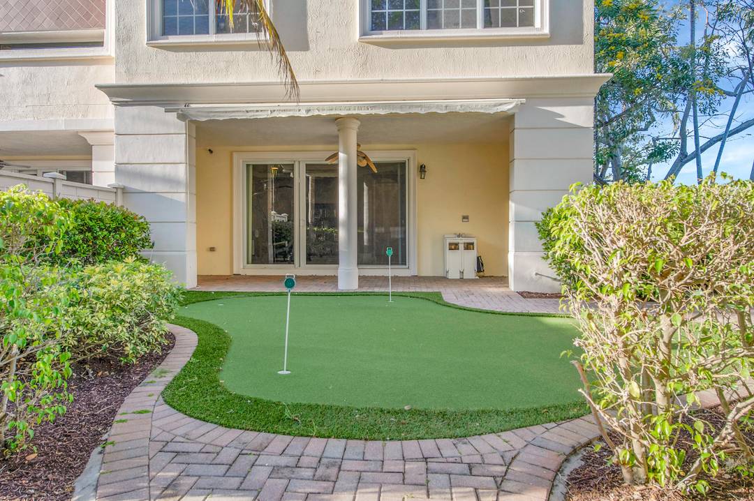 This impressive gated three story townhouse features 4 bedrooms, 3.