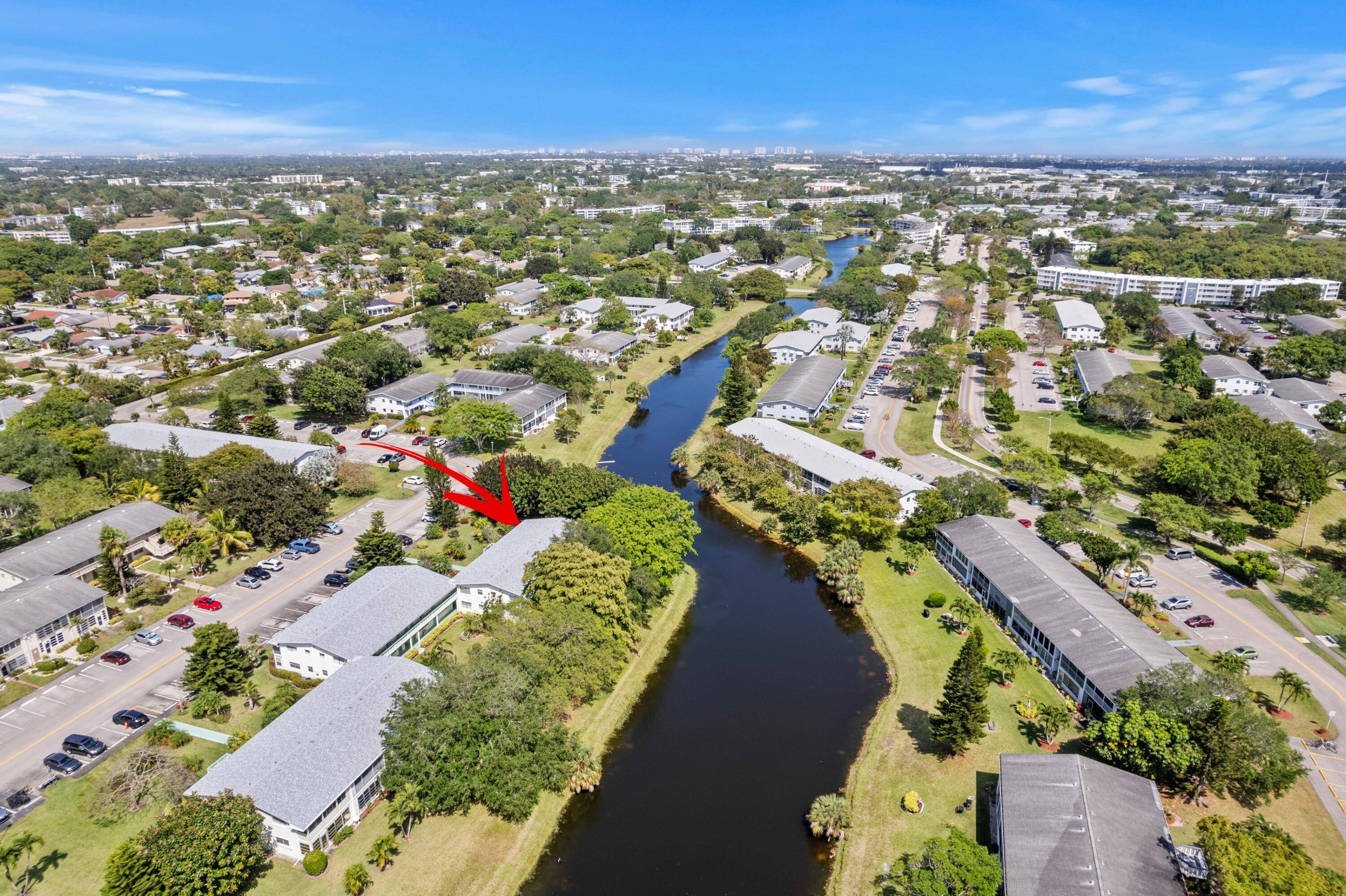 BEAUTIFUL WATERFRONT GROUND FLOOR CONDO CORNER UNIT PRESTIGIOUS GATED 55 COMMUNITY OF CENTURY VILLAGE BREATHTAKING WATER VIEWS BIKE JOG TRAILS OPEN GREEN SPACE NEW 2025 ROOF Spacious Open Floor Plan ...