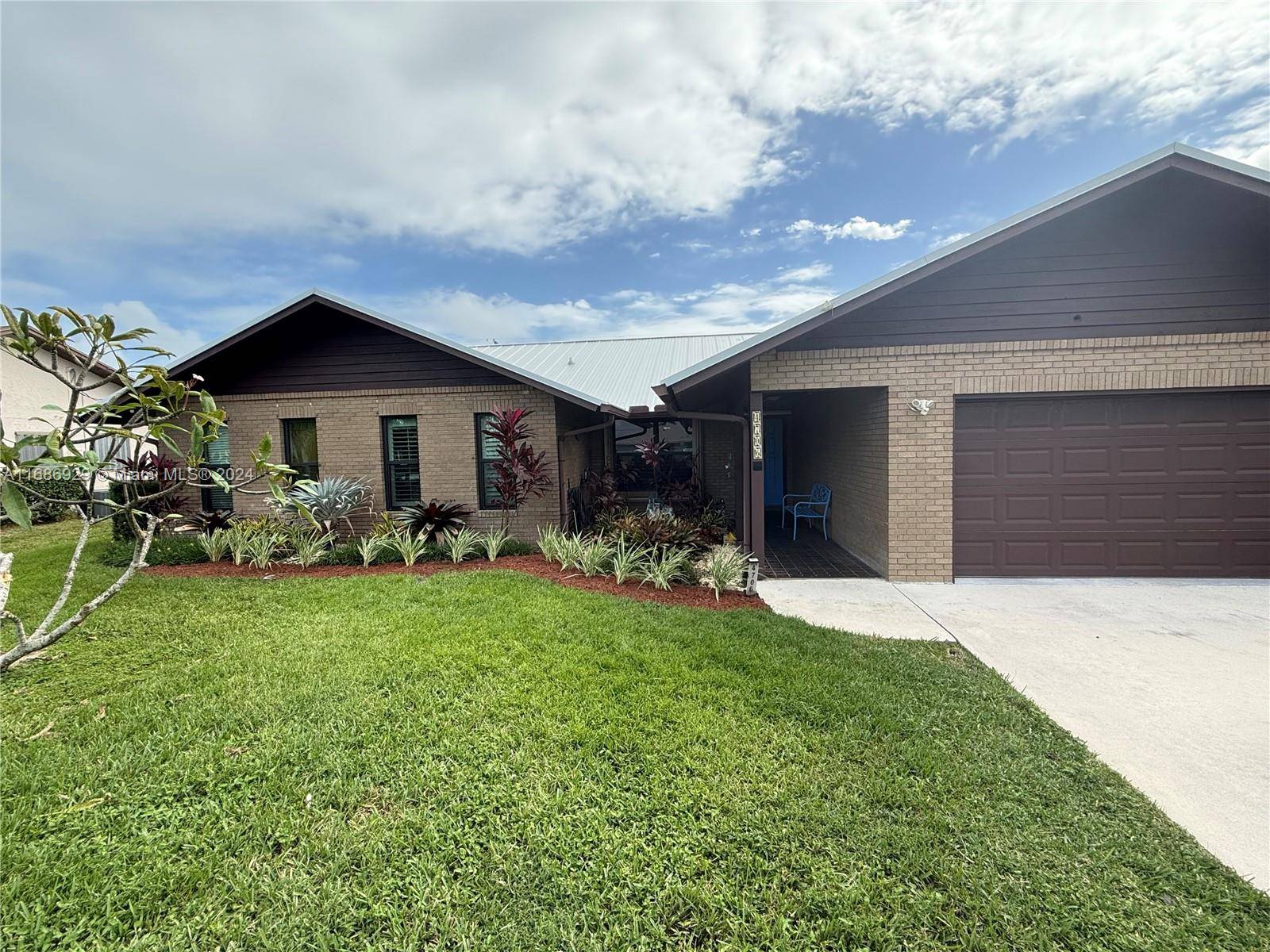 New metal roof in 2022, whole house generator, impact windows, pool, 400 SF screened lanai, new A C, 3 bed 2 full bath, solid brick construction with 2 car attached ...