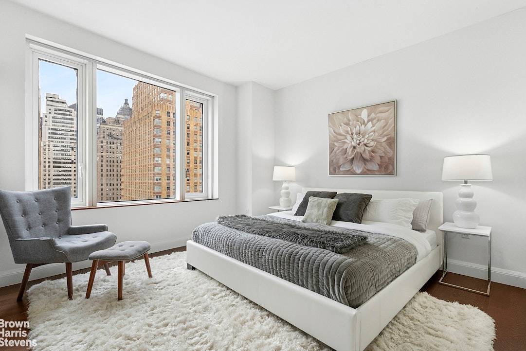 Welcome to this exceptional and unique corner four bedroom, three bathroom residence offering sweeping Hudson River sunsets and direct vistas of the iconic Freedom Tower.