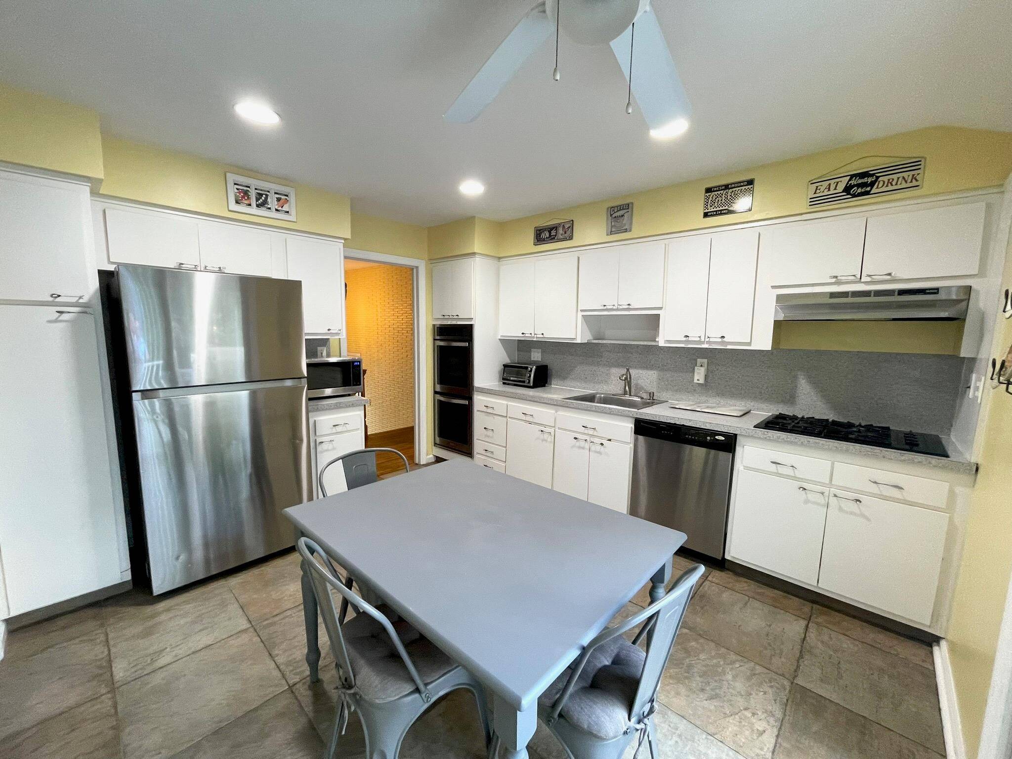 Updated and expanded raised ranch featuring four bedrooms, and 3 full bathrooms with Large entryway and coat closet, upstairs features, Eat in kitchen with white cabinets, stainless steel appliances, walk ...