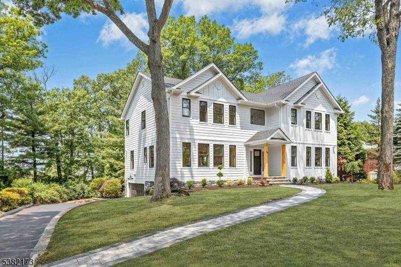 Experience refined living in this stunning new Craftsman style home featuring five spacious bedrooms, five full bathrooms, and a powder room.