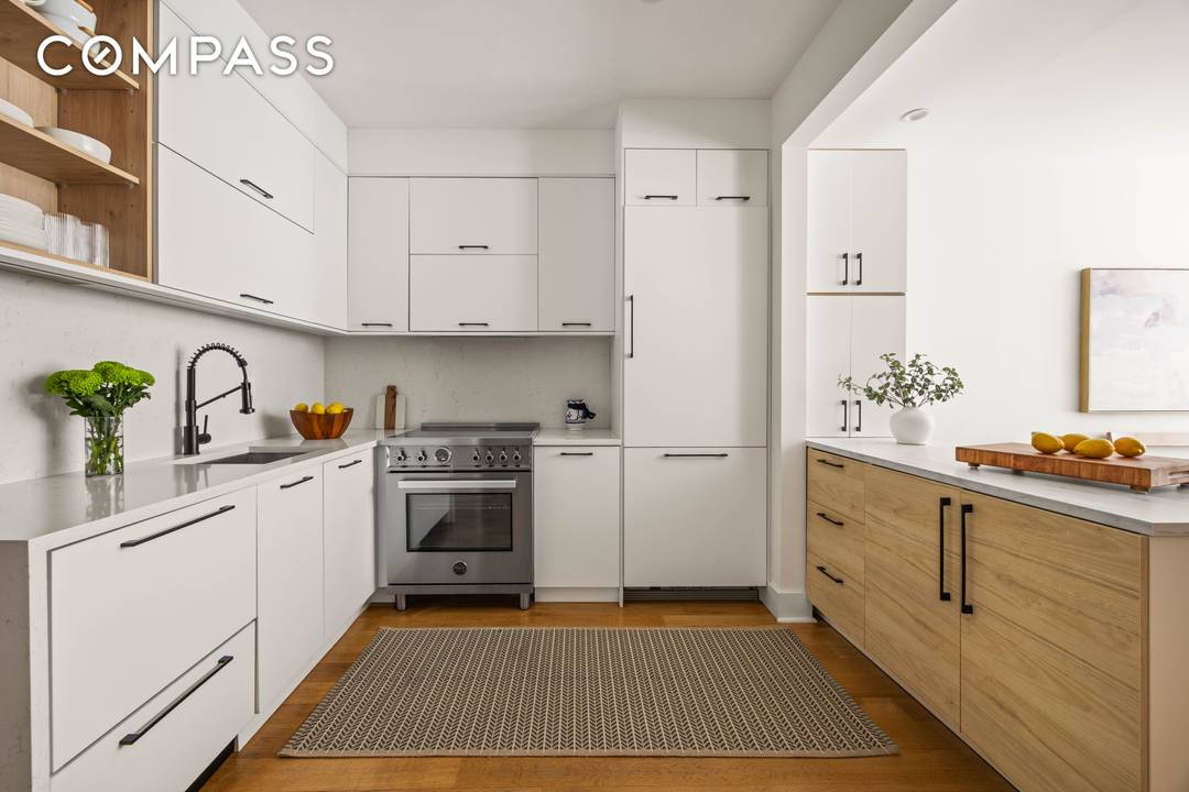 Bright, Elegant Garden Duplex with Private Backyard and Plentiful Storage This garden duplex offers warm, light filled living and dining spaces with charming bay windows and natural finishes throughout.