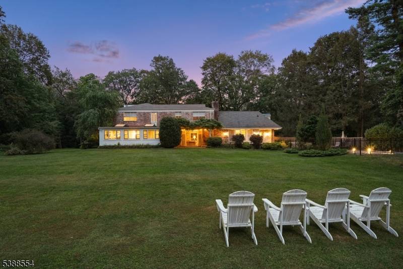 One of a kind 1938 brick residence privately situated on 1.
