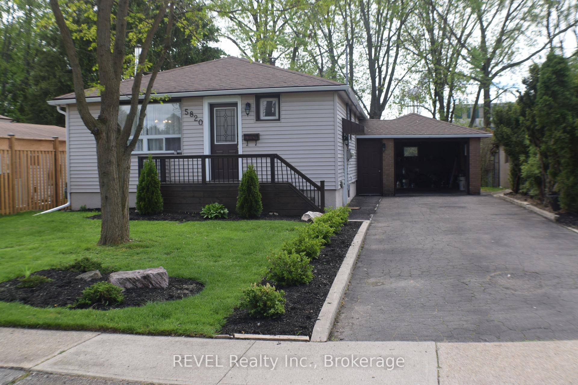 Welcome to 5820 Keith St, Open concept 2 Bedroom bungalow 2 Bathrooms and attached garage, Front landscaping and a very private backyard to enjoy the summer.