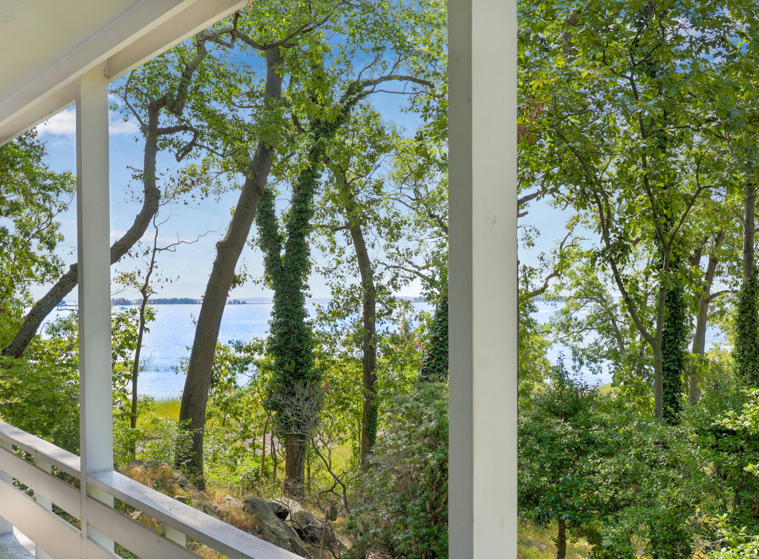 Rare mid century modern elevated waterfront property with extraordinary views in historic Village Creek.