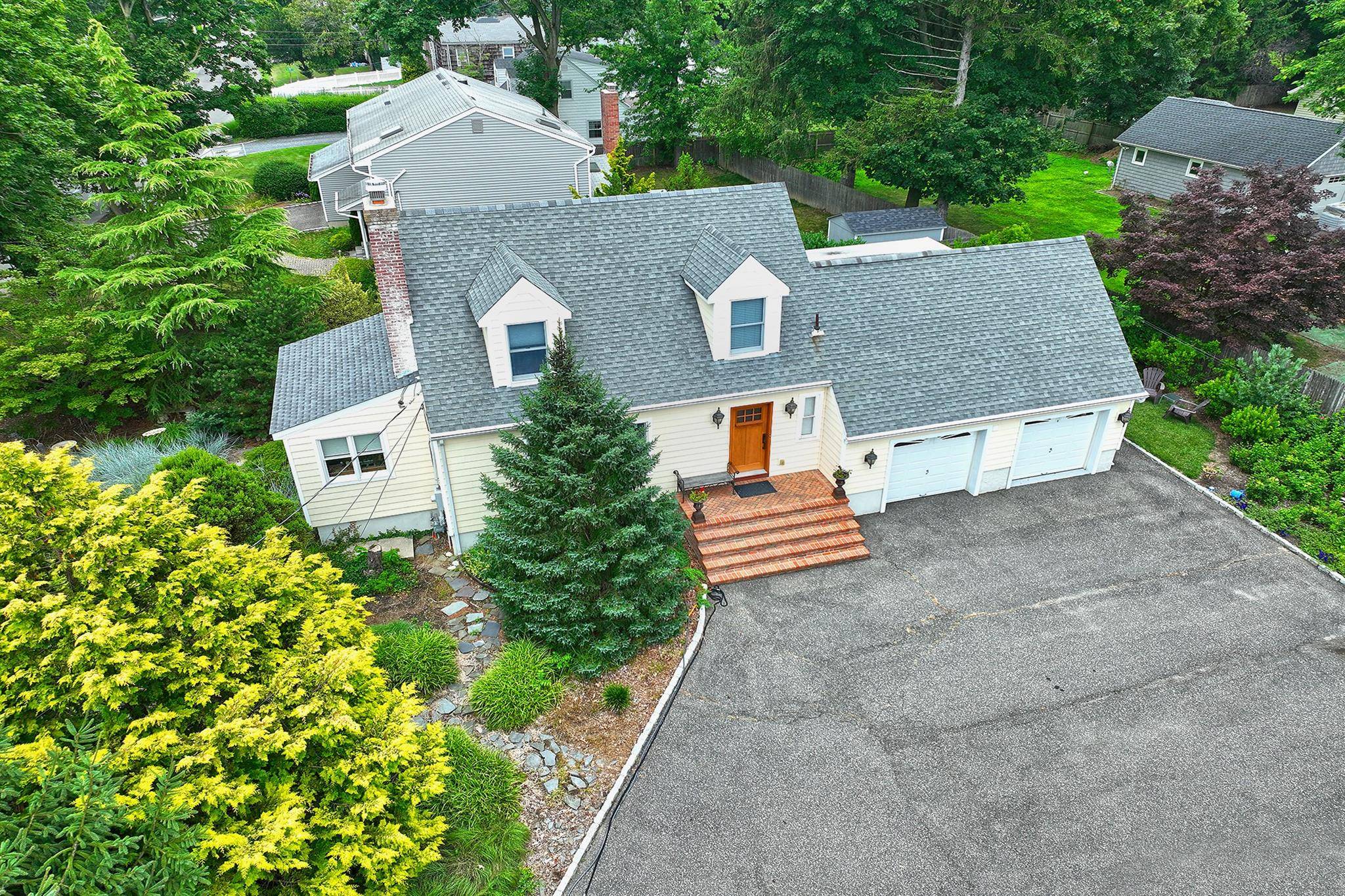 Welcome home to this meticulously updated expanded cape situated in the heart of Huntington.