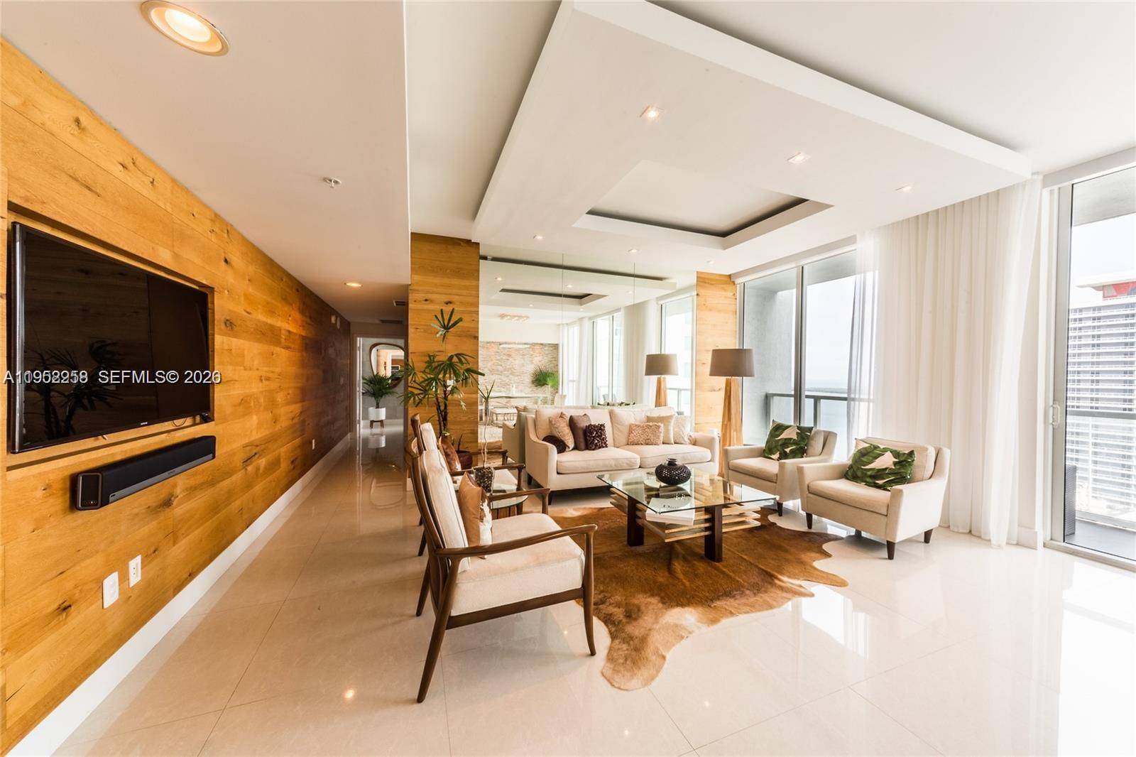 A rare, one of a kind residence featuring unique, custom finishes originally designed as the developer s showcase unit.