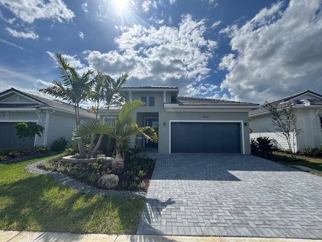 As you step through the front door of this Samantha Boca Raton home, you're immediately greeted by the warm elegance of porcelain tile floors that flow seamlessly throughout the home.