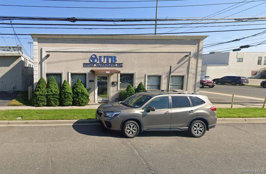 Discover a versatile full service office and industrial space at 146 E 2nd Street, Mineola, offering excellent visibility on a prominent corner lot.