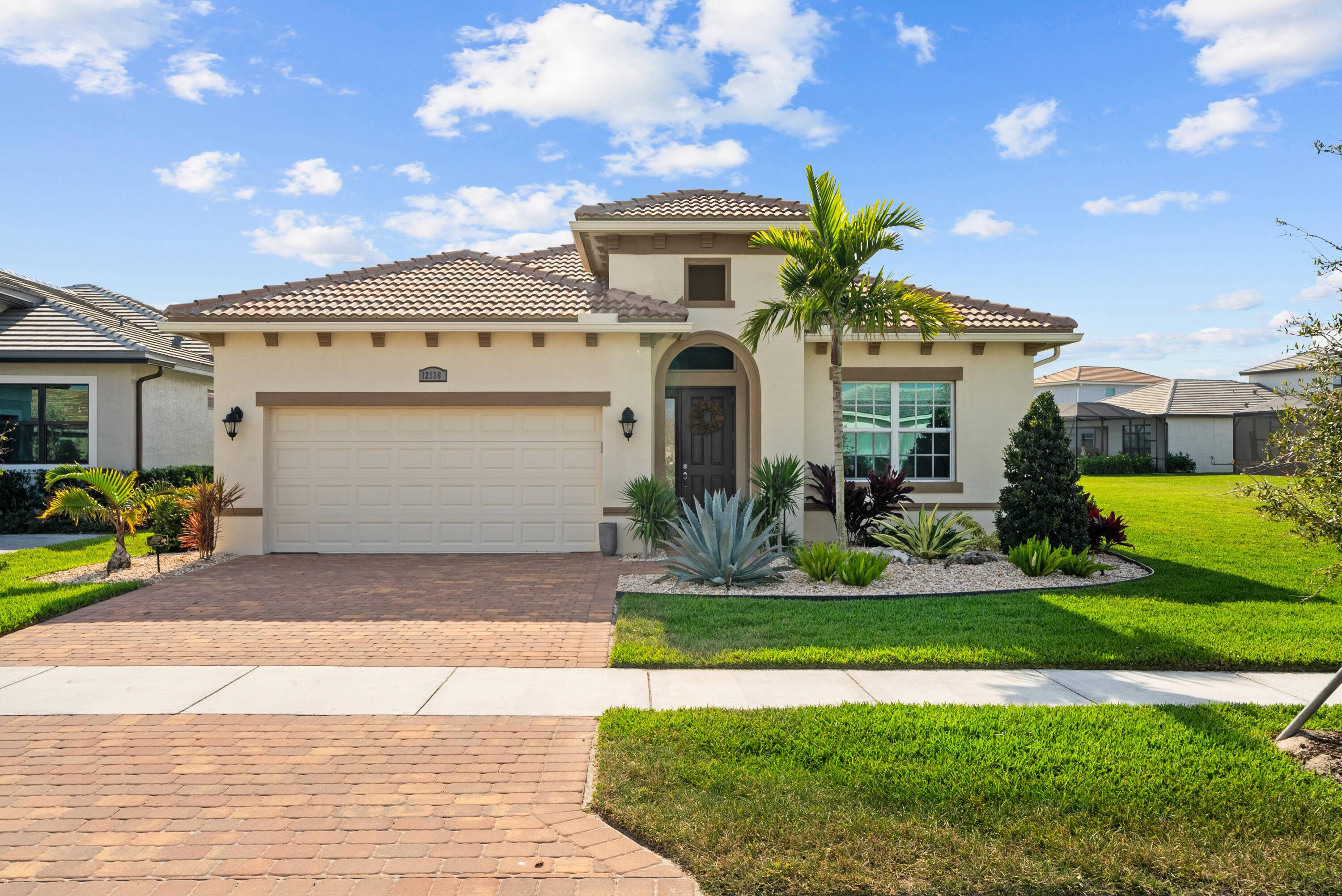 Gorgeous 3 2 Lago home in PGA Verano has an open floor plan with porcelain floors, wood closet space linen closet pantry, floor to ceiling tiled showers, large washer dryer ...