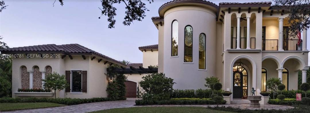Custom built waterfront home in Jupiter Tequesta in the manned security gated community of Heritage Oaks.