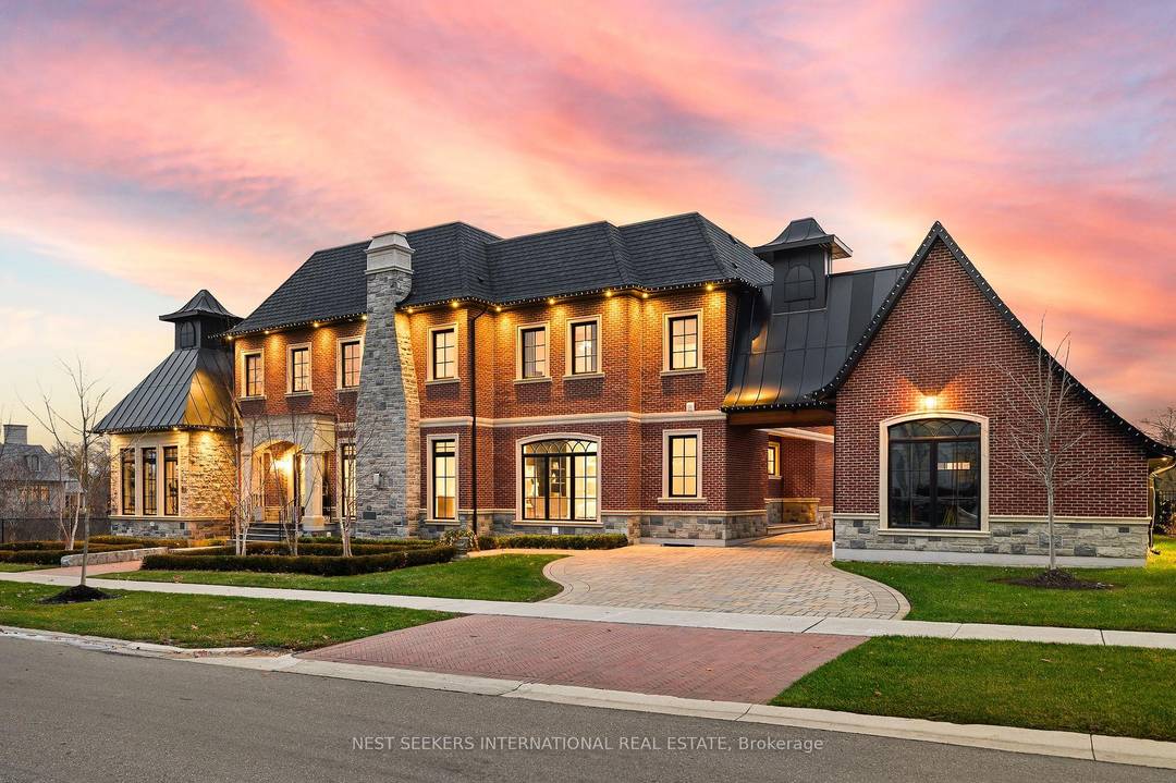 Experience uncompromising luxury in this custom built estate offering approximately 9, 500 sq.