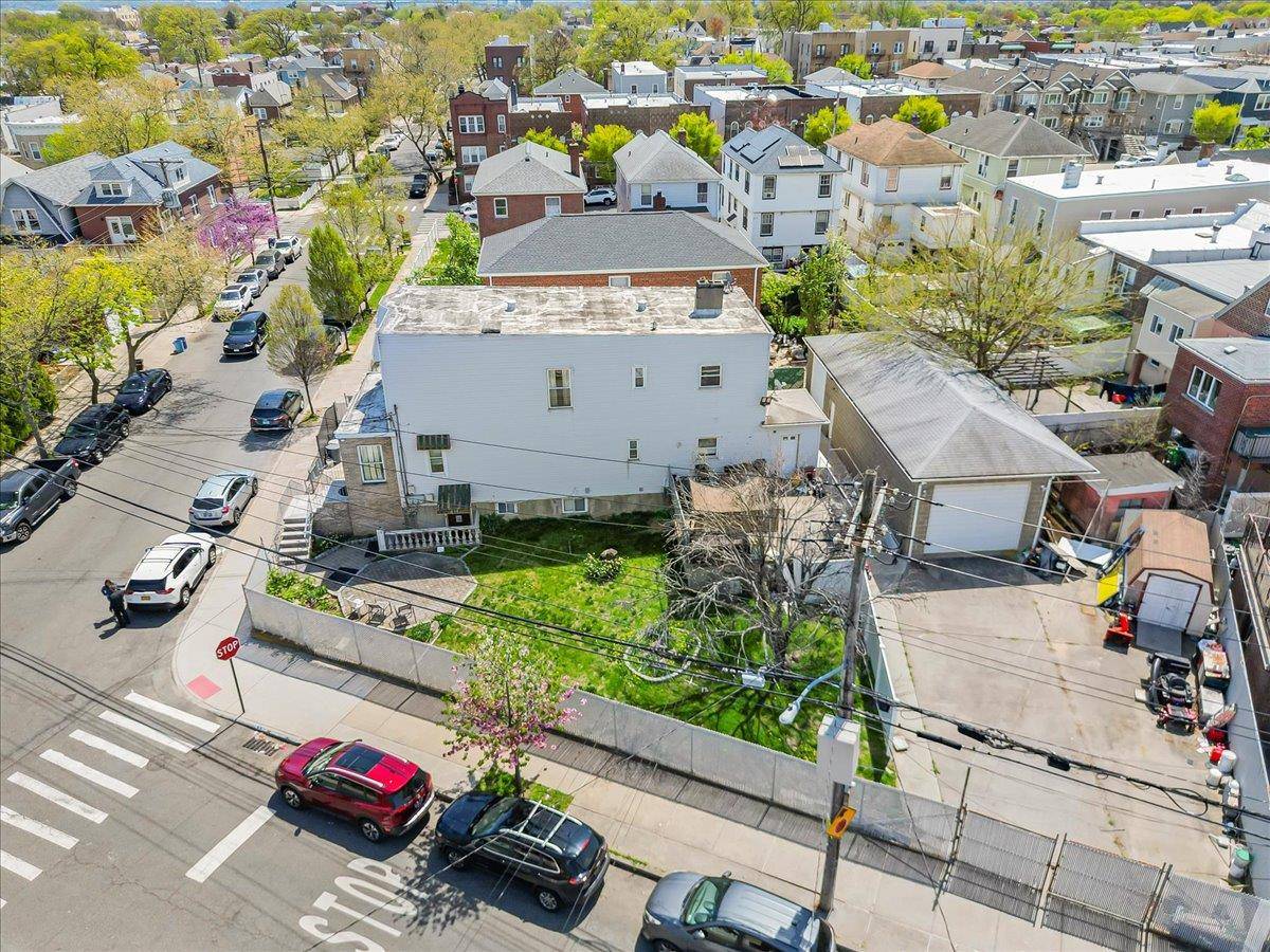 Large two family corner property in the Morris Park section, this home has it all, space, double lot, modern comfort with plenty of room to expand.