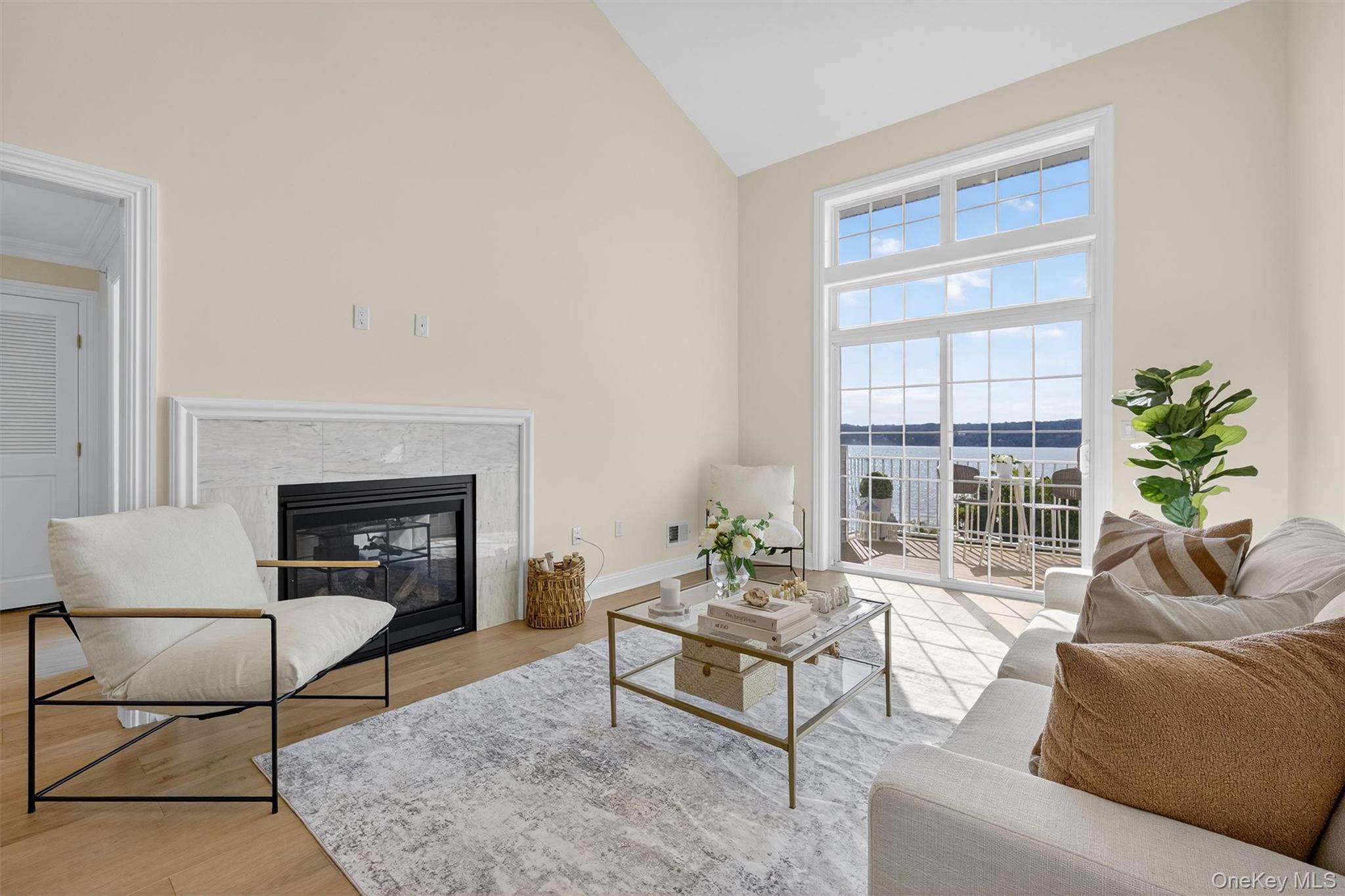 Welcome to this stunning townhome in the highly desirable Overlook Pointe II community, where modern design meets the beauty of the Hudson River.
