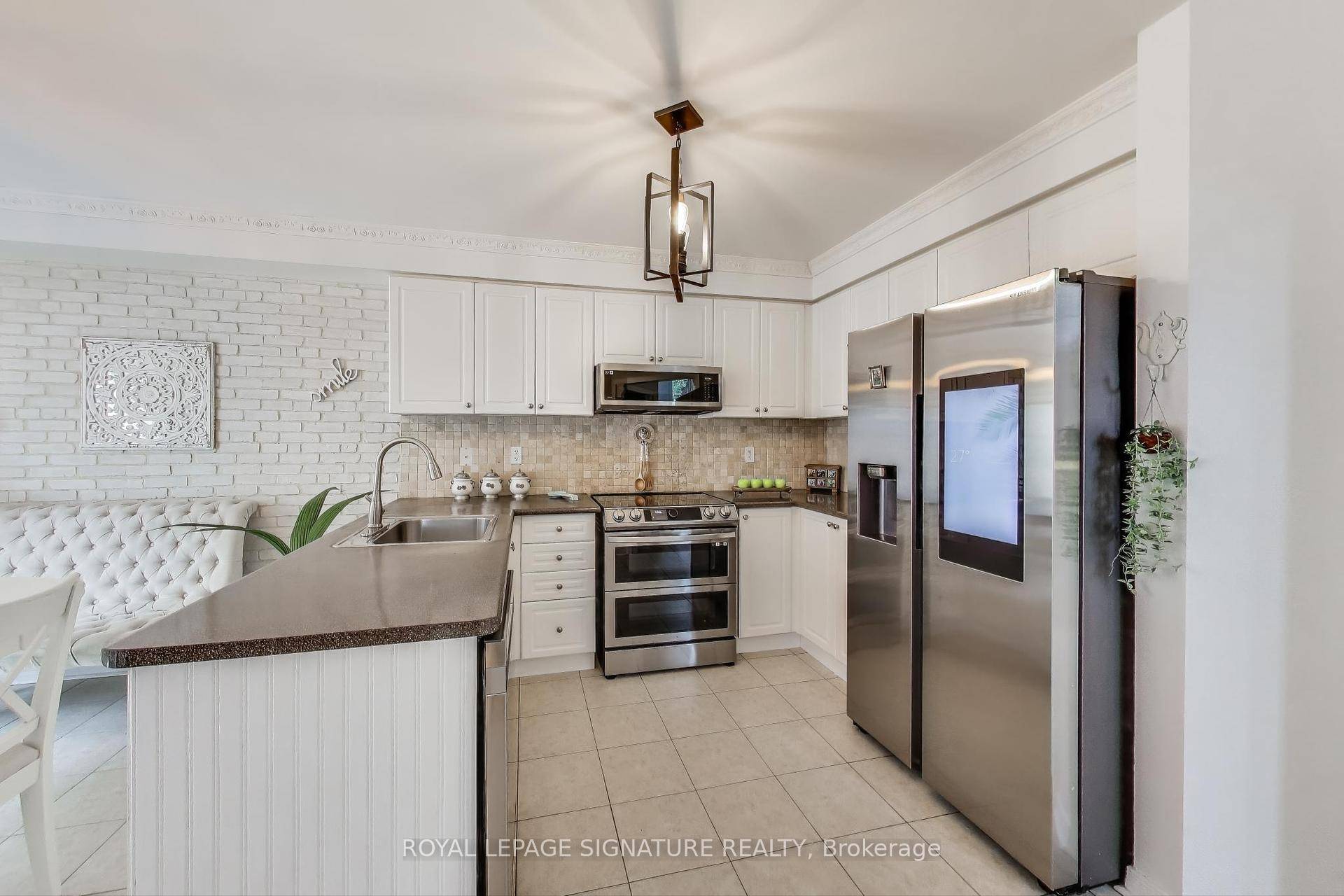 Welcome to 65 Red River Crescent Where Comfort Meets Charm This beautiful, move in ready corner unit freehold townhouse feels just like a semi and offers nearly 2, 500 sq.