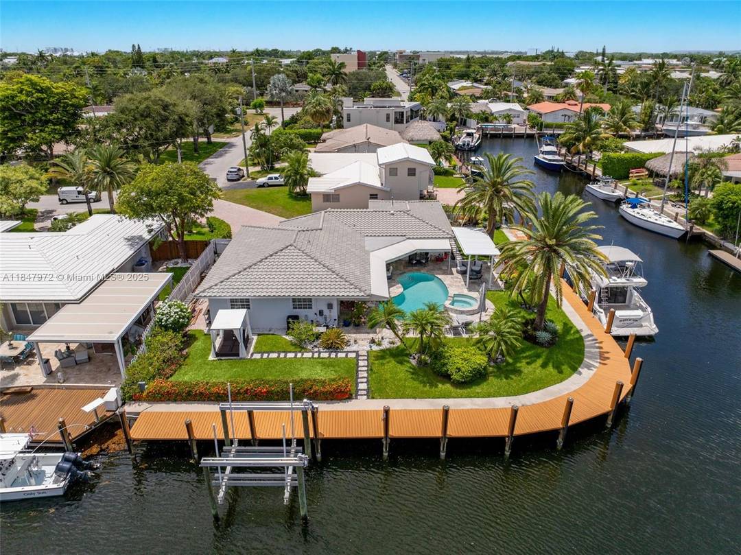 Elegant point lot residence offering 196' of deep water frontage with no fix bridges amp ; captivating water views from every room.
