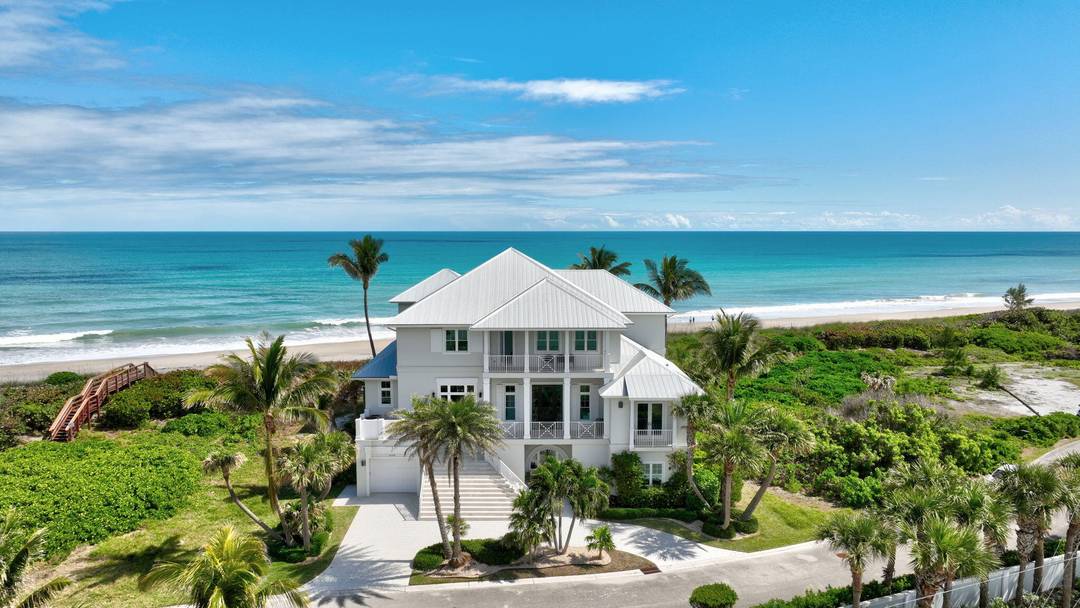 Experience the pinnacle of coastal living in this custom built, oceanfront masterpiece, offering 100ft of pristine beachfront and over 6000 sq ft of luxurious living space.