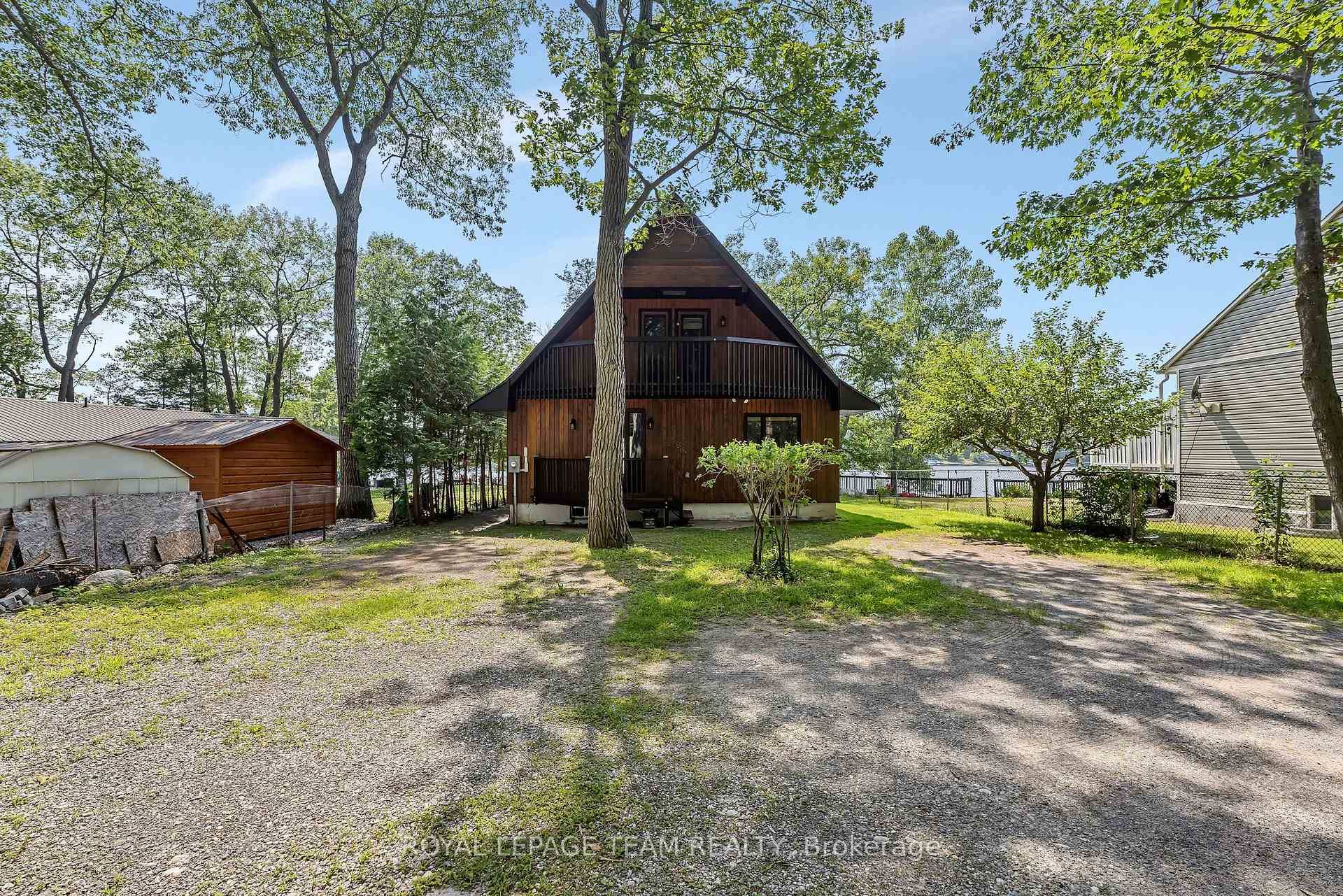 Situated on a point with a south facing waterfront, 1210 Bayview Drive has views of the river and spectacular sunsets.