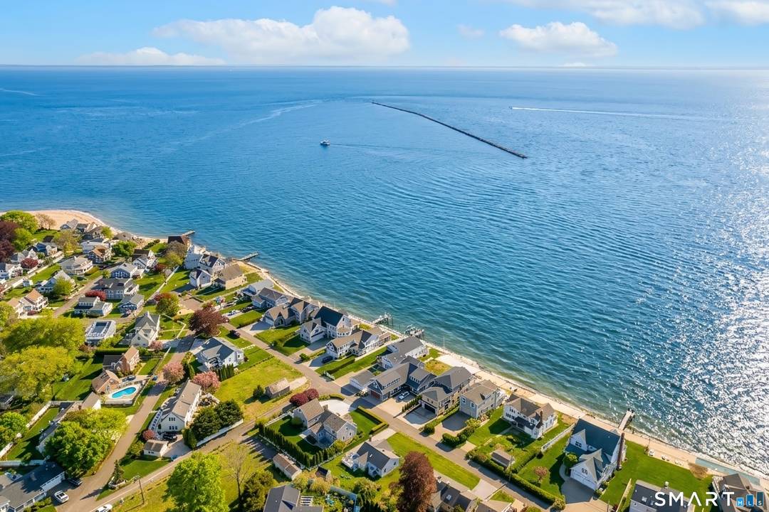 Welcome to exceptional direct waterfront living with breathtaking panoramic views of Long Island Sound and unforgettable sunsets from this stunning shoreline home.