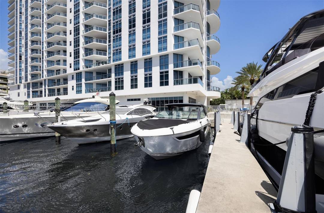 BOAT SLIP INCLUDED ! Residence 2009 at Marina Palms is a high floor southeast corner home with 3 bedrooms, 3.